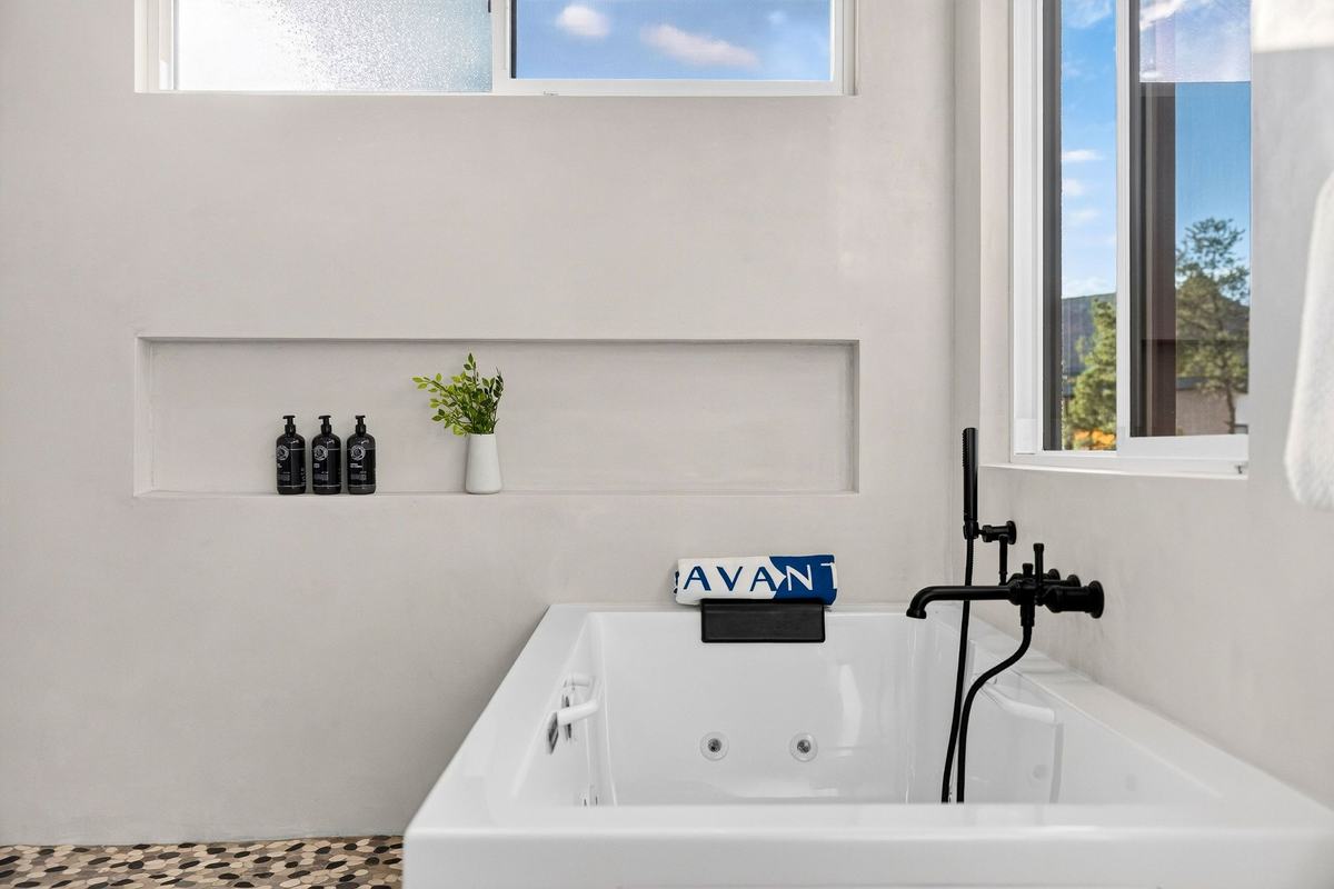 Jetted tub with chromotherapy lighting in the primary bath.